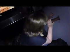 Wife blows a guy through the glory hole while hubby watches